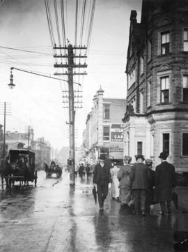 [View of Granville Street, north of Dunsmuir Street, in the rain]