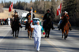 Day 83 RBC's torchbearer 63 Alana Adams carries the flame in Exshaw, Alberta