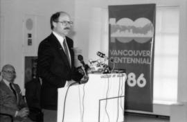 Mike Harcourt making announcement from podium at Vancouver Art Gallery