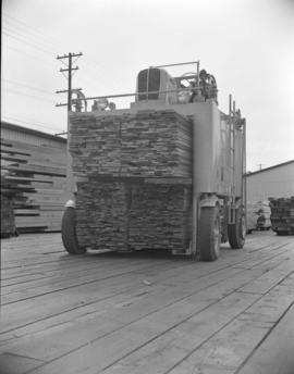 [Gerlinger carrier with a load of lumber]