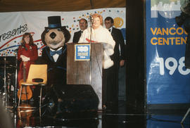 Woman speaking on stage at Vancouver's 99th birthday at the Vancouver Museum