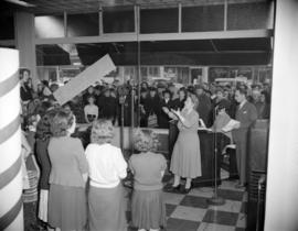 [Choir performing at Kelly's appliance store]