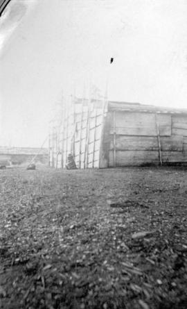 [First Nations lodge on a beach]