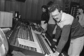 Group behind mixing boards at Griffiths Gibson Productions