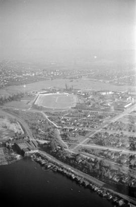 Aerial view of Hastings Park, looking north east, with squatters shacks on shore of Burrard Inlet