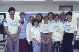 Group portrait of Centennial staff wearing Centennial t-shirts