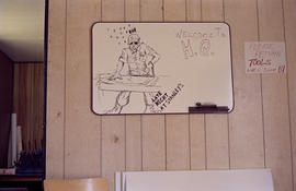 Whiteboard with drawing inside Centennial work trailer