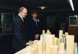 Unidentified man and Eric Jespersen looking at building models