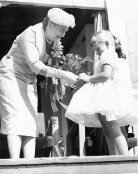 Olive Diefenbaker and young girl on stage during 1959 P.N.E. Opening Ceremonies