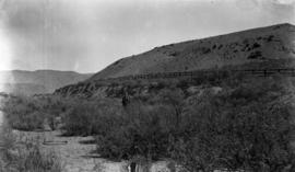 View of IMPOCO railway siding, storage tanks, at Asher