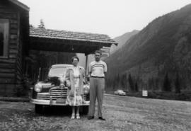 [Unidentified woman and man in front of the Sumallo Lodge]