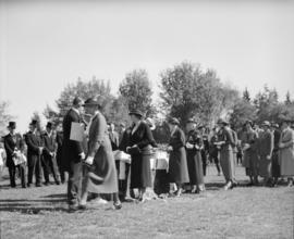 King's Jubilee parade and medal ceremony [Women and men receiving King's Jubilee medal]