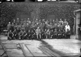 [Group photograph of male BC Sugar workers, wearing both suits and coveralls]