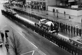 [Funeral procession of firefighter Don McCavour on Burrard Street, near Georgia]