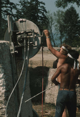 Stone tools - Back view of diamond blade saw with two sculptors