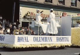 PNE Parade, on East Hastings, with Royal Columbian Hospital float and spectators