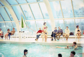 [People at indoor swimming pool]