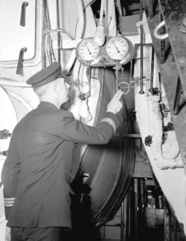 [Seaman taking a] barometer reading on a C.P.R. boat