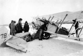 [Airforce plane being repaired in the snow]