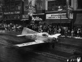 Pacific Wings Aircraft Sales taxiing airplane in 1953 P.N.E. Opening Day Parade