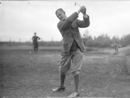 [Douglas Christie teeing off at the Jericho Country Club golf course]