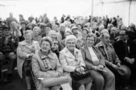 Group of people seated under canopy