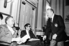 Group of three men talking