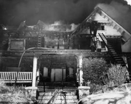 8:06 pm Monday Dec. 26/55 1131 Beach Ave [view of firefighters putting out house fire]