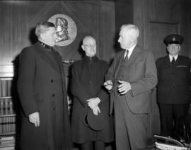 [Members of the Salvation Army, speaking with a man, possibly Mayor McGeer at City Hall]