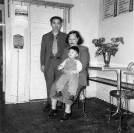 Gordon Yee, Gum May Yee, and son Vernon Yee in a café in Saskatchewan