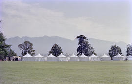 Nine white event tents in a row