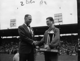 P.N.E. General Manager A.P. "Bert" Morrow presenting trophy to 1966 Inter High Track fi...