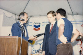 George Puil handing award to two men