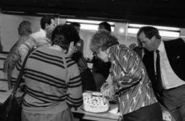 Two women looking at birthday cake