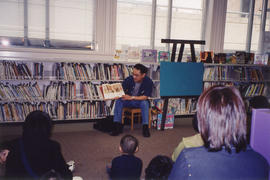 Paul Yee signing book at Richmond Public Library during Asian Heritage Month festival