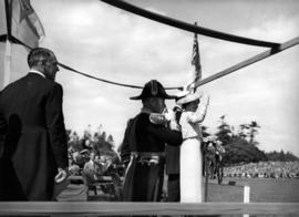 [King George VI and Queen Elizabeth on a reviewing stand at Beacon Hill Park]