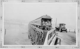 First passenger train crossing bridge : April 24, 1929