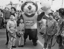 Tillicum with performers at Chinese New Year Parade