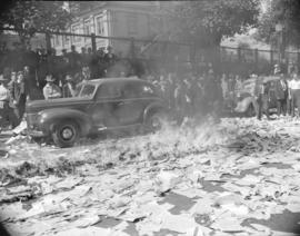 [Men burning newspapers and a car in the street during a strike at the Vancouver Daily Province n...