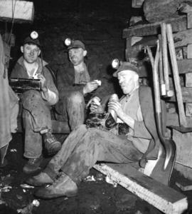 [Group of miners having lunch]