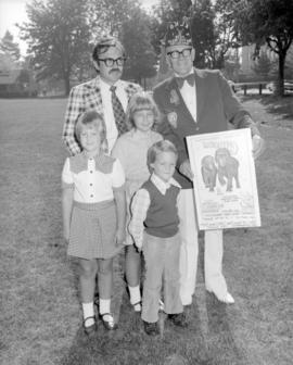 [Jim Johnstone from Elks Lodge No. 1 displays a poster for a preview of the] Canadian Internation...