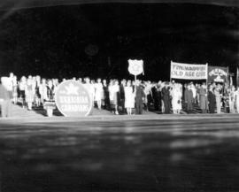 [Various groups line a road during Diamond Jubilee Celebrations]