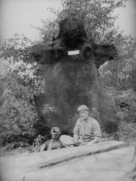 Mr. Scuff - copy from a lantern slide [A man and a dog in front of a bear skin]