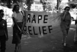 Gay Pride Parade 1985 : Gay/Lesbian Library [Rape Relief banner]