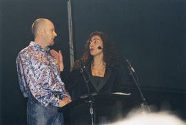 Thomas Hunt and Carmen Aguire presenting the award for Outstanding Performance