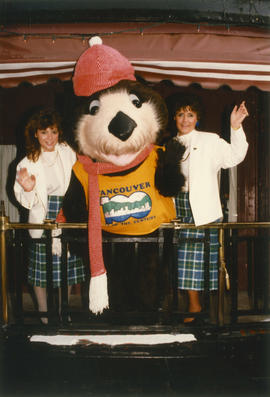 Tillicum posing with two Centennial Commissioners