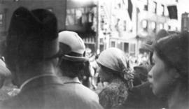 A group of people watching a parade