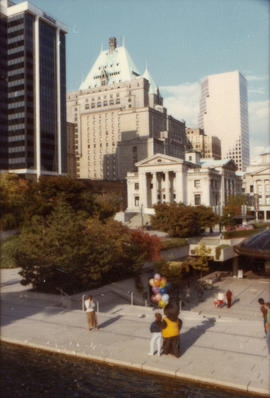 View from above of Tillicum holding balloons in downtown Vancouver