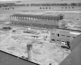 General view showing first & second lift forming of pump warehouse walls, chimney in foreground