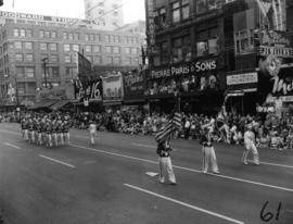 Women in uniform marching in 1955 P.N.E. Opening Day Parade